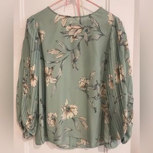 Beautiful turquoise crepe blouse. Very good quality material.